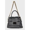 Leather bag with a brand's logo