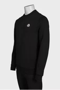 Men's black sweatshirt with a patch