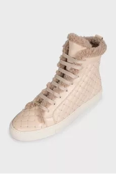 Beige boots with leather decoration