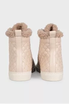 Beige boots with leather decoration