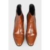 Perforated leather ankle boots