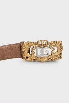 Leather belt with a massive figured buckle