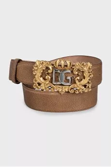 Leather belt with a massive figured buckle
