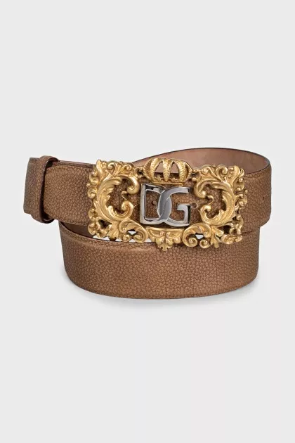 Leather belt with a massive figured buckle