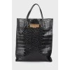 Leather bag with reptile embossing
