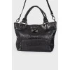 Leather bag with embossing for reptile