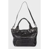 Leather bag with embossing for reptile