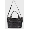 Leather bag with embossing for reptile