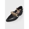A chain and pearls shoes