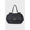 Leather bag, voluminous on the sides