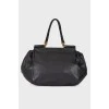 Leather bag, voluminous on the sides