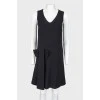 Straight cut dress with a bow in the front