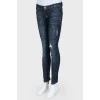 Ripped and worn effect jeans