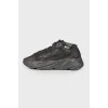 Black textile sneakers with tag