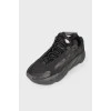 Black textile sneakers with tag