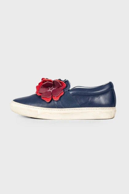 Leather slip-ons with floral appliqué