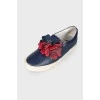 Leather slip-ons with floral appliqué