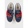Leather slip-ons with floral appliqué