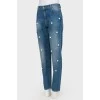 Jeans with pearl effect beads and tag