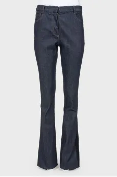 Broken jeans with stripes