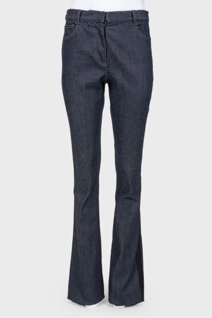 Broken jeans with stripes