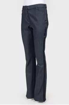 Broken jeans with stripes