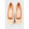 Curved suede stilettos