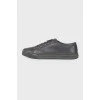 Black eyelet sneakers