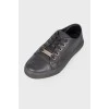Black eyelet sneakers