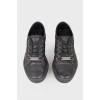 Black eyelet sneakers