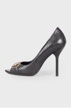 Shoes with embossed brand logo