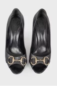 Shoes with embossed brand logo