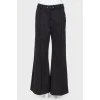 Flared trousers with arrows