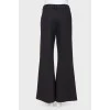 Flared trousers with arrows