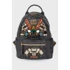 Backpack with an applique of rhinestones
