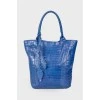 Blue bag with feather accessory