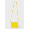 Bright yellow bag on the shoulder belt