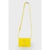 Bright yellow bag on the shoulder belt