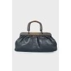 Leather bag with wooden handles