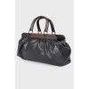 Leather bag with wooden handles