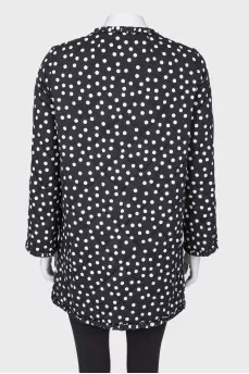 Black coat in polka dots
