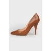 Caramel colored leather pumps